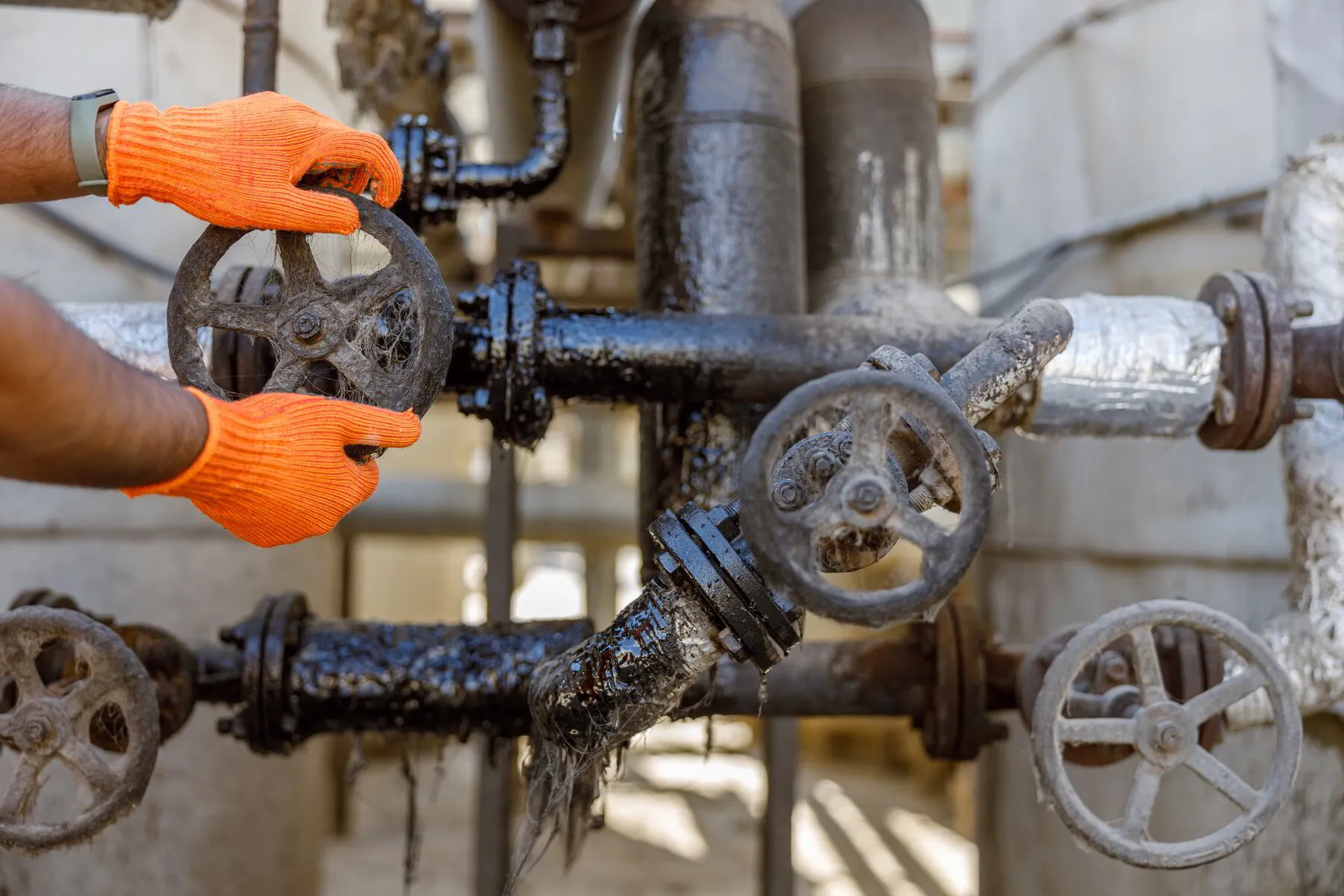 TK Plumbing certified engineer performing backflow preventer inspection and testing in Sarasota FL
