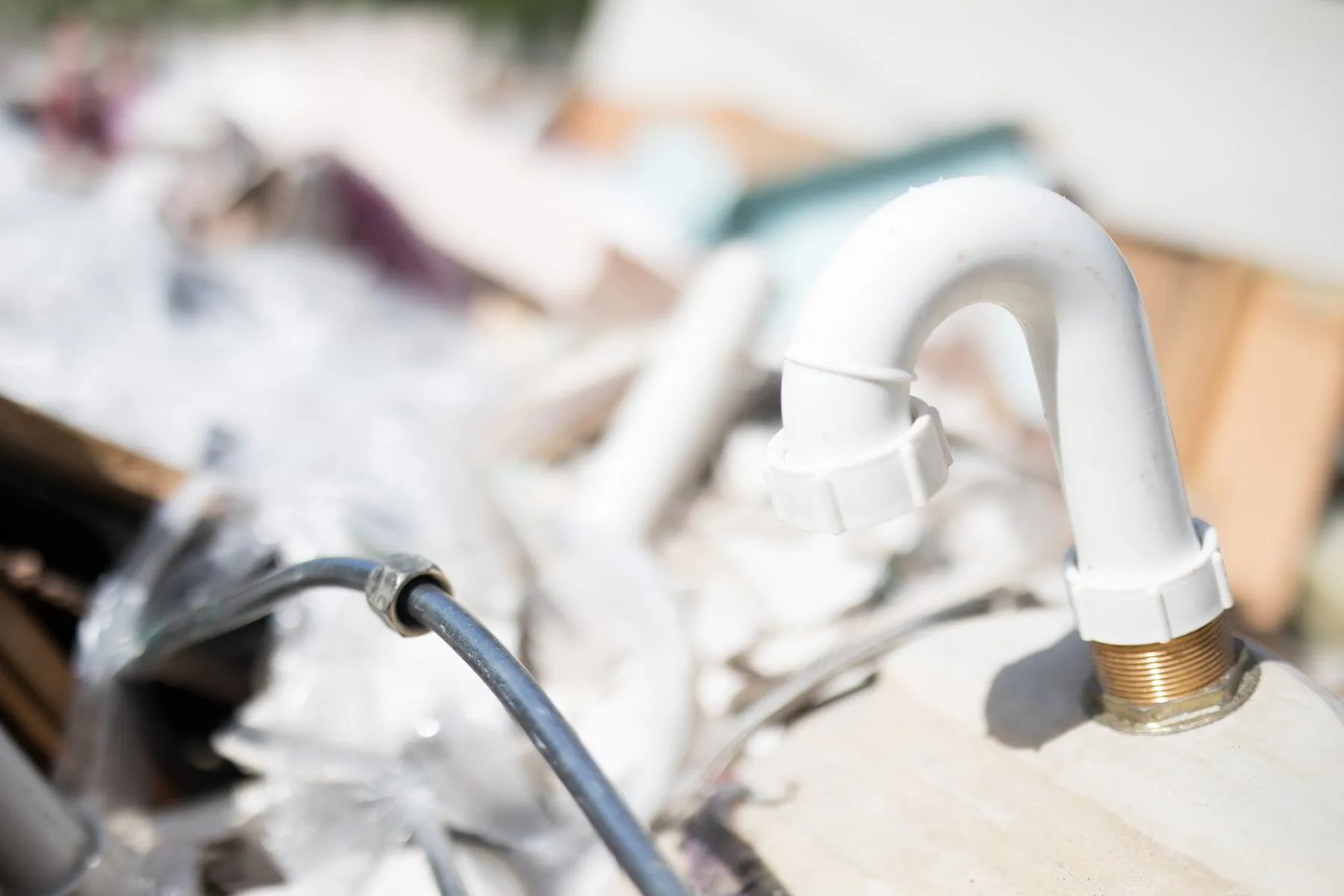 TK Plumbing professional installing new kitchen drain plumbing in Bradenton