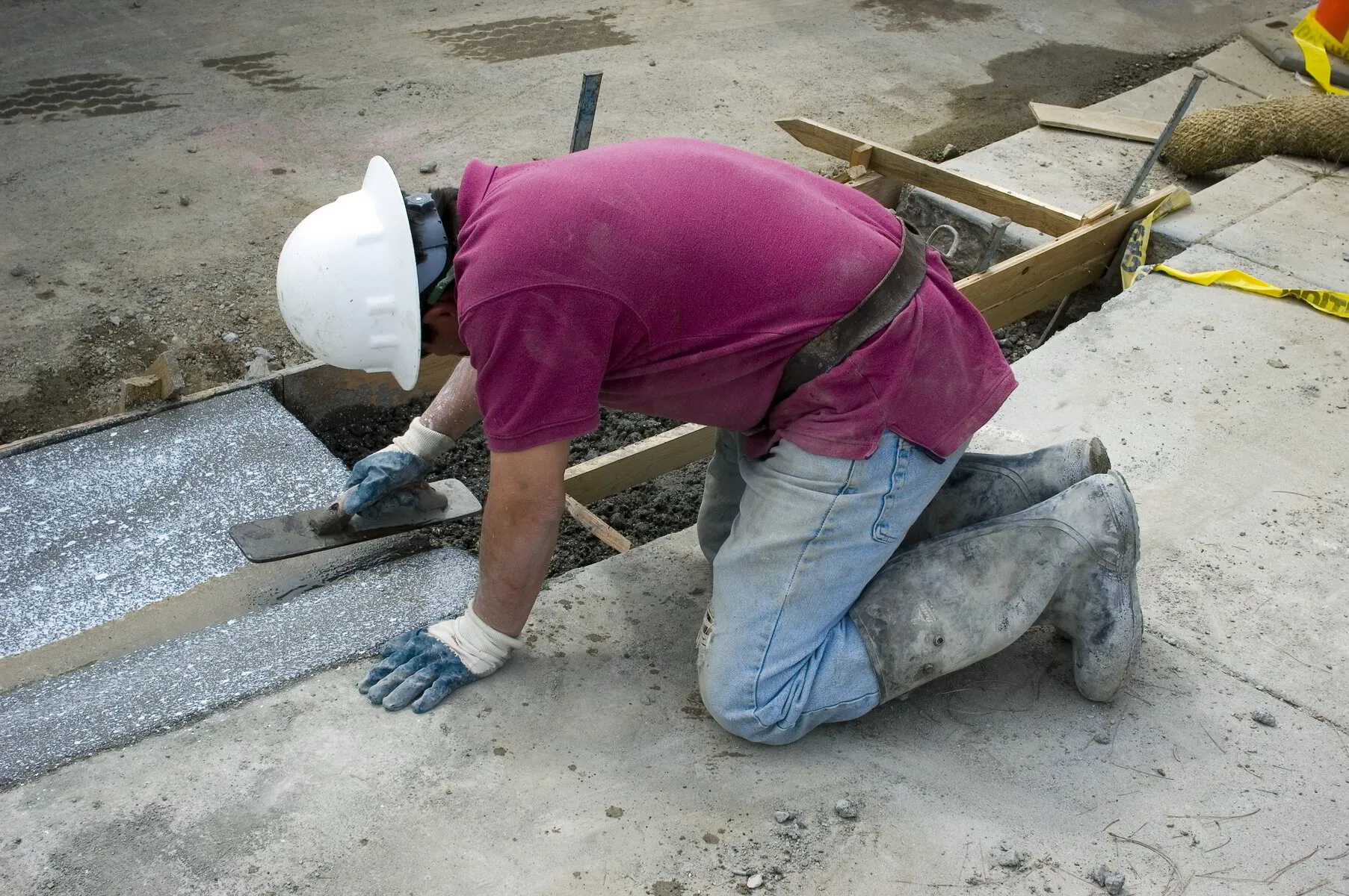 TK Plumbing crew restoring concrete after slab leak repair in a Sarasota home